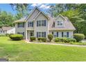 Attractive two-story home with a well-kept lawn and welcoming entrance at 15 Skipton Ct, Sharpsburg, GA 30277