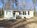 Well-maintained single-story home featuring a brick facade, black shutters, and a neatly landscaped front yard at 914 Mercury Nw Dr, Atlanta, GA 30331