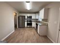 Updated kitchen featuring stainless steel appliances, granite countertops and white cabinets at 1068 Longshore Dr, Decatur, GA 30032