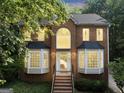 Charming two-story brick home featuring many windows that provide natural light into the home at 1625 Clark Lake Nw, Acworth, GA 30102