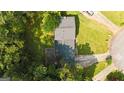 Top-down aerial view showcasing the roof, driveway, and surrounding greenery at 1486 Harbour Oaks Rd, Tucker, GA 30084