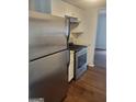 Modern kitchen featuring stainless steel appliances and a gas range at 5579 Marbut Rd, Lithonia, GA 30058