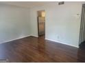 Inviting living room featuring wood floors, neutral walls, and plenty of natural light at 5579 Marbut Rd, Lithonia, GA 30058
