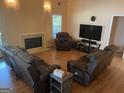 Inviting living room with a fireplace, ample seating, and a modern TV setup, perfect for relaxation and entertainment at 740 Pebble Blvd, Covington, GA 30016