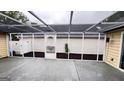 View of the spacious screened-in porch at 155 Cottage Club Dr, Locust Grove, GA 30248