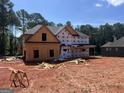 Exterior view of a new home under construction, showcasing the framing and preparation for siding at 140 Wilson Drive, Mcdonough, GA 30252