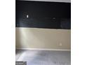Bedroom with a blackboard accent wall above neutral tone paint and carpeted flooring at 121 Fountain Oak, Villa Rica, GA 30180