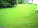 The beautiful grassy backyard offers plenty of space for outdoor activities and relaxation at 225 Long Creek Dr, Covington, GA 30016