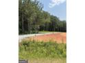 Cleared homesite featuring natural surroundings and gravel road at 380 Ayers Rd, Bowdon, GA 30108