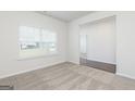 Bright, carpeted living room with large window offering plenty of natural light at 280 Oliver Dr, Locust Grove, GA 30248
