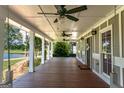 Relaxing covered porch offering picturesque views of the tranquil lake at 3170 Monroe Jersey Rd, Covington, GA 30014