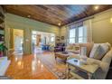 Open-concept living room showcasing wood ceilings, tile floors, and natural light at 5143 Floyd Ne St, Covington, GA 30014