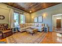 Comfortable living room with a neutral color palette and classic furnishings at 5143 Floyd Ne St, Covington, GA 30014