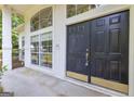 Inviting front entrance featuring a double door with sidelights and a covered porch at 111 Kenton Pl, Peachtree City, GA 30269
