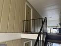 Exterior hallway providing access to units, with railing and well-kept building facade at 5147 Roswell Rd # 47, Atlanta, GA 30342