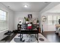 Bright office space with two windows, wood floors, and a stylish rug, perfect for a productive work environment at 3692 Wartrace Dr, South Fulton, GA 30331