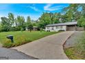 Charming, renovated brick ranch on a lush lot with a long driveway, offering curb appeal at 30 Mary Ella Dr, Carrollton, GA 30116