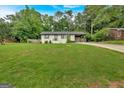 Charming, renovated brick ranch on a lush lot, offering curb appeal and ample space at 30 Mary Ella Dr, Carrollton, GA 30116
