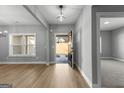 Inviting foyer with light wood floors, an open floor plan, and natural light streaming through the windows at 296 Deer Creek Run # 11, Moreland, GA 30259