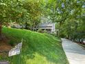 Charming home with a well-manicured lawn and a long driveway leading to the property at 610 Lake Dr, Snellville, GA 30039