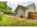 A spacious backyard with a patio area, perfect for outdoor entertaining and relaxation at 345 Morning Star Dr, Temple, GA 30179