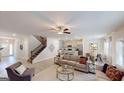 Spacious living room with stairs and an open layout that connects to the kitchen and dining area at 263 Eason St, Bowdon, GA 30108