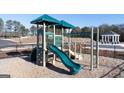 Community playground area with slides and climbing equipment at 1402 Grand Branch Dr, Lawrenceville, GA 30045