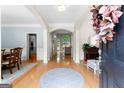 Spacious foyer featuring hardwood floors and arched entryways to adjacent rooms at 1602 Cascade Overlook, Peachtree City, GA 30269