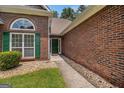 Close-up of the brick facade and green front door of the house at 2928 Mandy Ct, Jonesboro, GA 30236