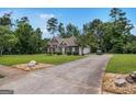 Long driveway and home with brick exterior at 2928 Mandy Ct, Jonesboro, GA 30236
