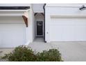 Welcoming home featuring two garages and an inviting front door at 375 Auburn Valley Way, Auburn, GA 30011