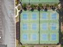 Aerial view of the community's tennis courts, offering a great recreational amenity with parking spaces nearby at 330 Bay Grove Rd, Loganville, GA 30052