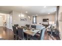 Open-concept living and dining area with hardwood floors and neutral-colored furnishings at 2276 Waycross Ln # 21, Dacula, GA 30019