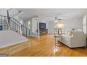 Bright living room features hardwood floors, a cozy fireplace, and a neutral color palette at 242 Adair St, Decatur, GA 30030