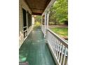 Inviting, covered porch, perfect for relaxing and enjoying the outdoors at 304 Tunis Rd, Mcdonough, GA 30253