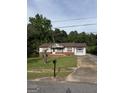 Inviting single-story home with a bay window, a front yard and a long driveway at 5225 Silhouette Sw Ln, Mableton, GA 30126