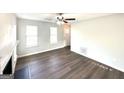 Bright living room boasting modern flooring, a cozy fireplace, and ample natural light at 4320 Catalpa Way, Ellenwood, GA 30294