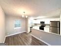 Open kitchen with granite countertops and stainless steel appliances at 2784 Rockdale Dr, Decatur, GA 30034