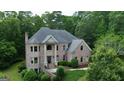 Beautiful brick home nestled among mature trees at 115 Robinwood Ct, Fayetteville, GA 30214