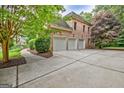 Spacious three-car garage and large driveway at 115 Robinwood Ct, Fayetteville, GA 30214