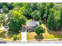 A birds eye view of a well maintained house with mature trees and landscaping at 1120 Bagwell Dr, Kennesaw, GA 30152