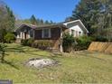Brick home exterior with landscaped yard, highlighting its traditional design and suburban setting at 420 Dot Dr, South Fulton, GA 30349