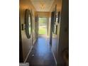 Inviting hallway with classic tile flooring and decorative mirrors leading towards the main living areas at 420 Dot Dr, South Fulton, GA 30349