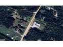 Aerial view of the property showing the land with outlined boundaries for clarity, located off Highway 155 at 2353 Highway 155 N, Mcdonough, GA 30252