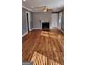 Bright living room with hardwood floors, fireplace, and natural light streaming through the front door at 615 Cofield Dr, Hapeville, GA 30354
