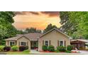 Charming single-Gathering home featuring traditional architecture and mature landscaping at 55 Ashton Pl, Covington, GA 30016