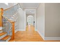 Spacious foyer features hardwood floors, staircase and open access to the rest of this beautiful home at 3451 Fairway Dr, College Park, GA 30337