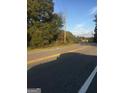 Street view highlighting the road and the surrounding trees at 1810 Highway 138 E, Stockbridge, GA 30281