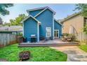 Spacious backyard with a wooden deck, outdoor seating, a grill, and a fire pit at 638 Mcgruder Ne St, Atlanta, GA 30312