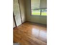 Bedroom with wood floors and a window at 341 Boxwood St, Social Circle, GA 30025